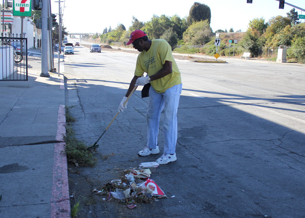 Supervisor Miley surveying garbage on side of road, raising awareness on illegal dumping
