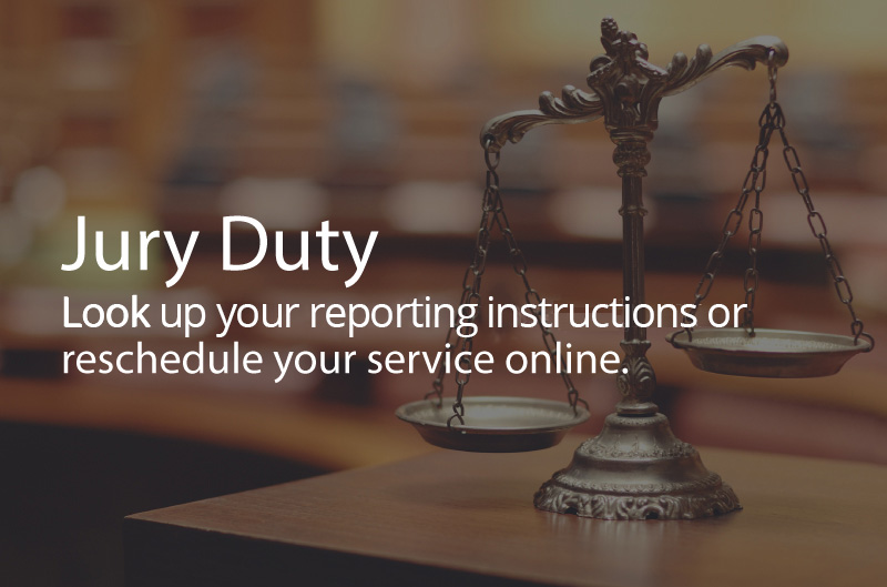 Photo the scales of justice in a courtroom. Caption: Jury Duty. Lookup your reporting instrctions or reschedule your service online.